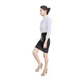 A woman wearing white shirt and black leather skirt standing sideways in beige high heels