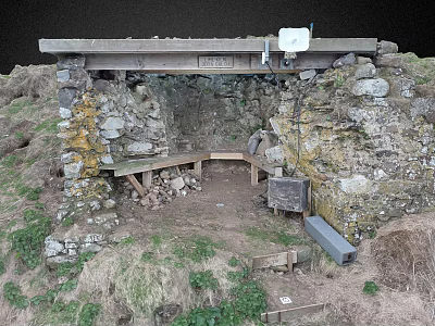 Outdoor Stone Structure With Wooden Beam Bench And Dirt Ground Surrounded By Grass 3d model