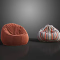 Two Different Bean Bag Chairs with Orange Velvety and Colorful Striped Designs