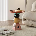 Colorful Modern Side Table With Geometric Stacked Base Holding Cake Tray In Living Room