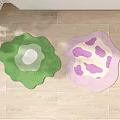 Two Decorative Irregular Shaped Rugs Green White Center and Pink Purple Spots on Wooden Floor