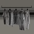 Row of Clothes Hanging on Hangers with Various Styles Striped Patterns and Gray White Tones
