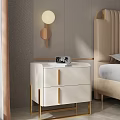 Modern Cream Colored Bedside Table With Drawers Gold Handles And Alarm Clock In Bedroom