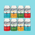 Atlanta Brewing Co Canned Drinks In Assorted Colors Arranged On Light Blue Background