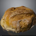 Freshly Baked Round Bread With Golden Crusty Surface And Flour Dusting