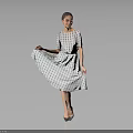 Woman Lifting Patterned Dress Standing With High Heels On Gray Background