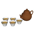 Brown Ceramic Teapot And White Teacups With Yellow Tea On White Background