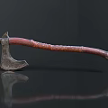 Ancient Battle Axe With Intricate Metal Head And Carved Wooden Handle