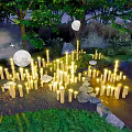 Outdoor Lights Illuminating Natural Garden With Grass Stones Stream Trees And Moonlit Night