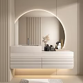 Modern Bathroom Vanity With Round Backlit Mirror White Countertop Drawers Toiletries And Vase On Top