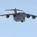 Gray Passenger Airplane Flying With Extended Wings In Overcast Sky