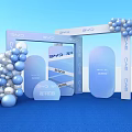 Blue Arch Event Gateway With Balloon Decorations Blue Carpet And Transparent Chairs For Tipsy Market