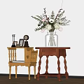 Two Light And Dark Wooden Side Tables With Vase Flowers And Decorative Items