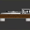 Modern Turntable With Silver Platter Metal Tonearm Wooden Base And Control Buttons