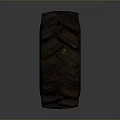 Heavy Duty Black Tire With Deep Tread Blocks On Gray Background