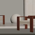 Modern Accent Chair Featuring Wooden Frame Beige Cushion And White Spherical Decor In Minimalist Interior