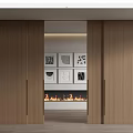 Open Wooden Sliding Doors Revealing Fireplace And Decorative Artworks In Interior
