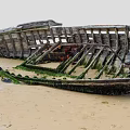 Old Abandoned Wooden Boat on Sandy Beach with Green Moss and Weathered Wood