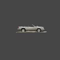 Burnt Convertible Car With Damaged Front End And Rust On Road Surface