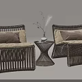 Rattan Table Chair Set with Beige Cushions Small Round Table and Vase with Dried Flowers