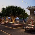 Rooftop Bar with String Lights Pool Tents Wooden Deck and Outdoor Seating
