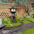 Japanese Courtyard Garden With Wooden Deck Stone Lanterns Arched Bridge And Red Maple Tree