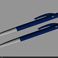 Two Blue Ballpoint Pens With Silver Accents Laid On Gray Surface
