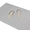 Beige Flip-Flops Placed On Beige Woven Mat For Cozy Home Use