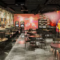 Vintage Bar Interior Design With Retro Posters Wooden Tables And Green Plants