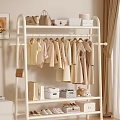 Cozy Living Room With Beige Clothes On White Rack Handbags Storage Boxes And Stuffed Bear