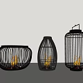 Garden Decorative Ornaments With Three Black Wicker Lanterns And Flaming Lights