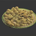 Assorted Mixed Nuts Placed On A Glass Plate With Orange Nutcracker