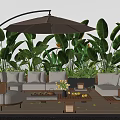 Comfortable Outdoor Sofa Set With Large Umbrella Green Tropical Plants And Wooden Coffee Table