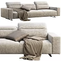 Modern Gray Fabric Three Seater Sofa With Brown Pillow And Checkered Blanket