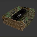 Black Cylindrical Weapon Marked ASSAI Placed in Wooden Crate with Camouflage Padding