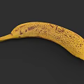 Fresh Ripe Yellow Banana With Natural Brown Spots On Dark Background