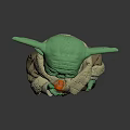 Green Alien Character In Brown Robe Holding Orange Fruit From Popular Sci Fi Series