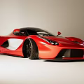 Red Supercar With Sleek Streamlined Body And White Accents Black Wheels