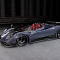 Gray Convertible Sports Car With Red Seats And Black Wheels Against Ancient Stone Columns