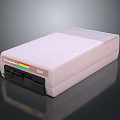 Vintage Commodore 128D Computer With Gray Casing Front Panel Buttons And Colorful Stripe Design