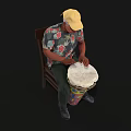 Man in Yellow Cap and Floral Shirt Sitting on Chair Playing Colorful Drum