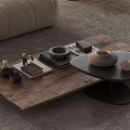 Wooden And Black Round Coffee Tables With Decorative Items Books And Vase In Living Room