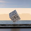 Floating Cube Sculpture with Intricate Inscriptions Against City Skyline and Calm Water Surface