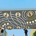 Ornate Outdoor Ceiling Design With Curved Structure Circular Lights and Decorative Elements