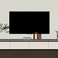 Modern White TV Stand In Living Room With Black TV Plant And Decorations
