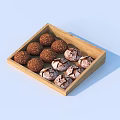 Delicious Chocolate Truffles In Wooden Tray With Brown Crumbs And White Cracks