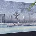 Silver Angel Sculpture With Circular Frame Against Gray Marble Wall Waterfall Pool And Green Plants