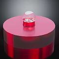 Red Circular Pedestal With White Topped Decorative Item And Red Accents