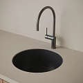 Modern Washbasin Design With Black Faucet On Light Colored Countertop And Light Gray Wall
