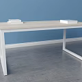 Light Wooden Top Desk With White Frame And Stack Of Books In Blue Wall Room